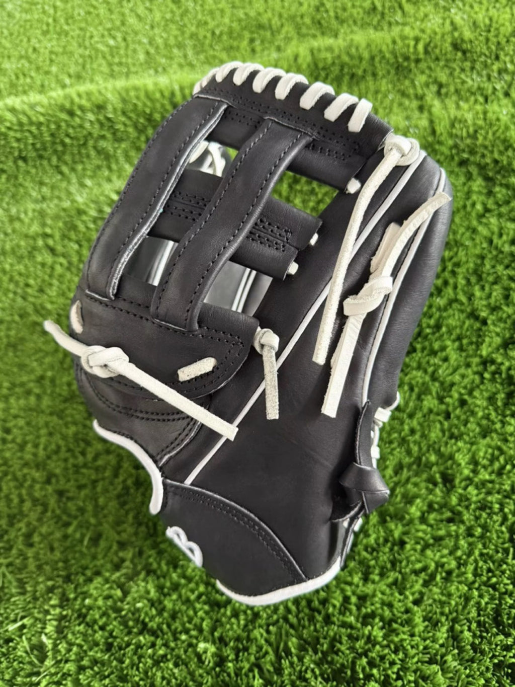 Black HTB Do Damage infield glove, H-web side view