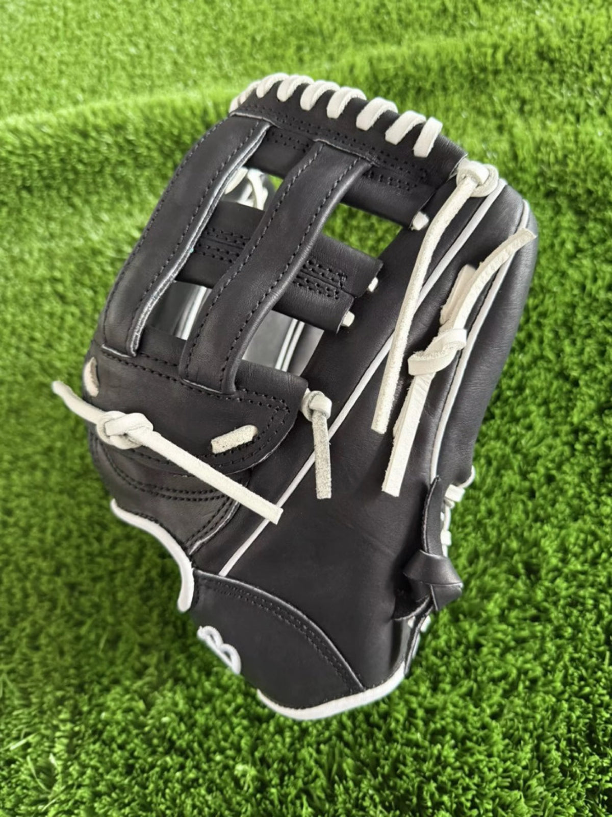 Black HTB Do Damage infield glove, H-web side view