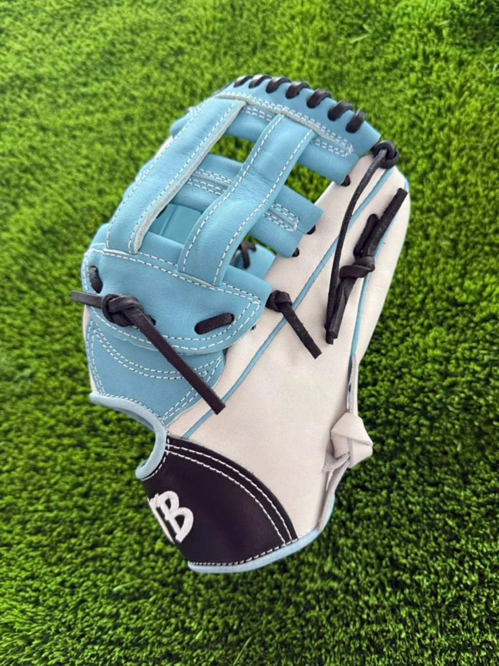 White and Columbia blue HTB Do Damage infield glove, H-web side view