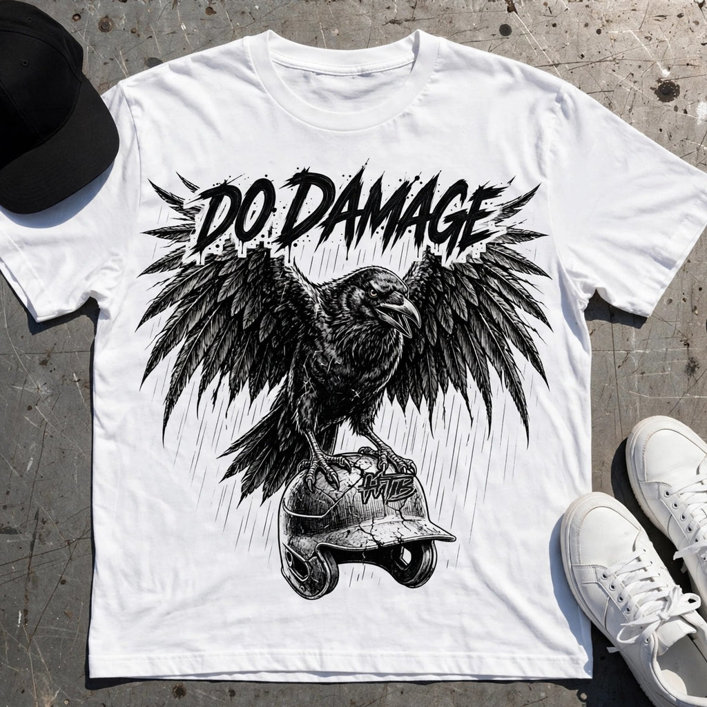 HTB Do Damage Crow Tee in white, flat lay on a metal loading dock plate with cap, sneakers and bat