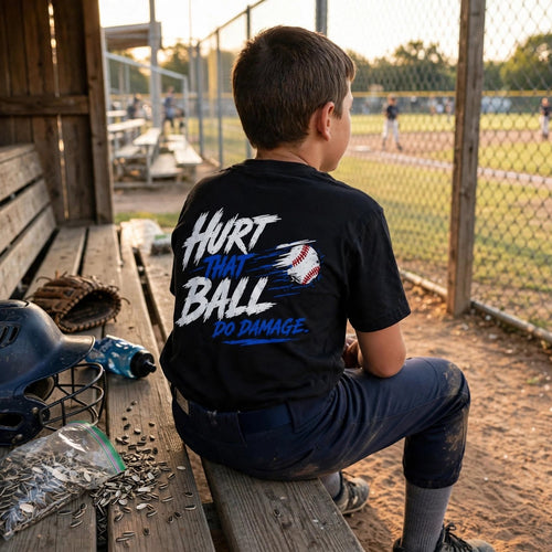 Youth Do Damage Heavyweight Tee lifestyle back - kid on dugout bench watching the game